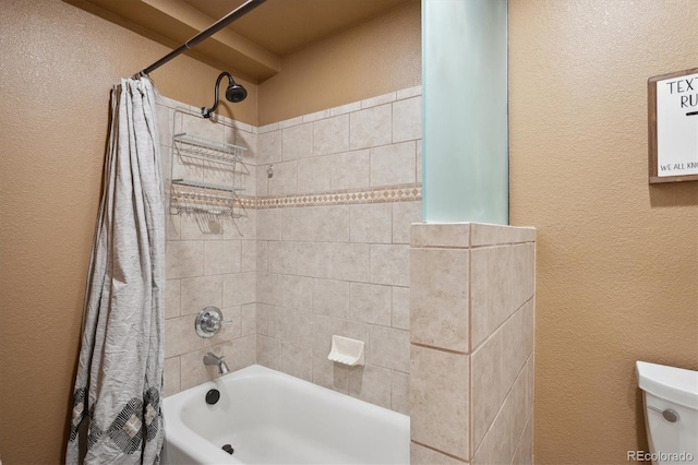 bathroom with toilet and shower / bath combo