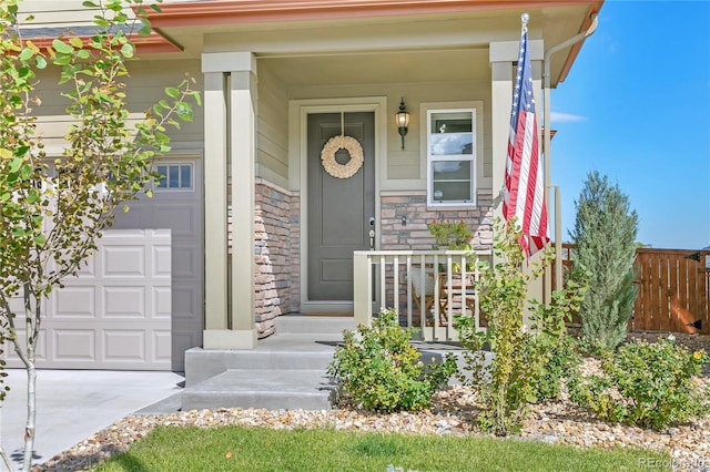 view of exterior entry with a porch