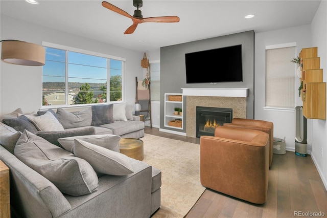 living room with hardwood / wood-style floors and ceiling fan