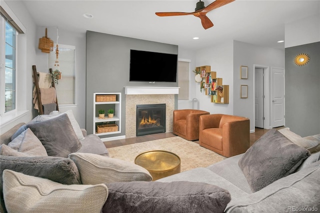 living room with hardwood / wood-style floors and ceiling fan