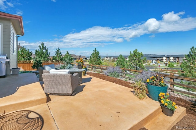 view of patio / terrace with area for grilling and an outdoor living space