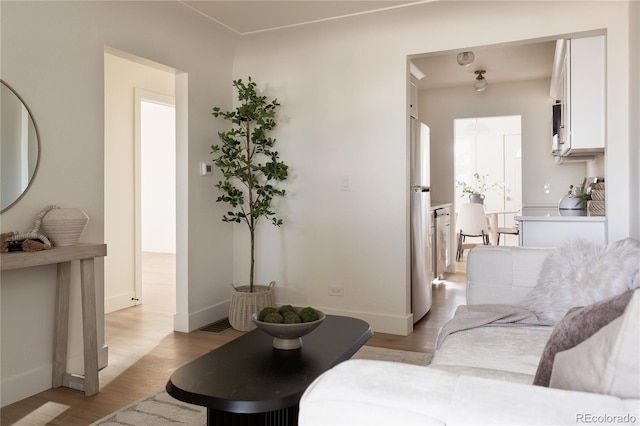 living room with light hardwood / wood-style floors