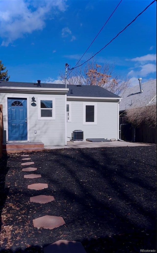 back of house featuring central air condition unit and a patio