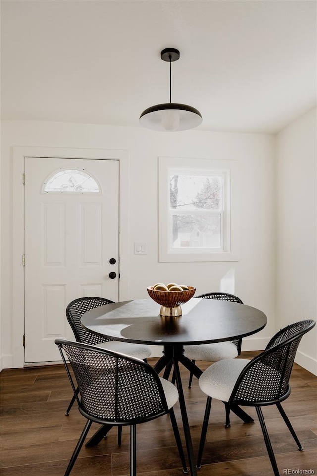 dining area with dark hardwood / wood-style floors