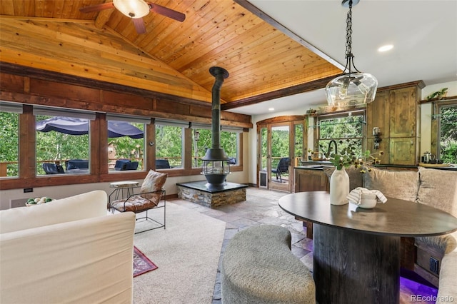 20033 Silver Ranch Rd, Conifer, CO 80433 - living area with a wood ceiling with exposed beams, ceiling fan, high vaulted ceiling, recessed lighting, and wooden walls