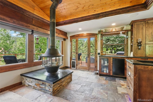 20033 Silver Ranch Rd, Conifer, CO 80433 - sunroom / solarium featuring a wood stove