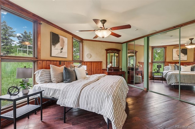 20033 Silver Ranch Rd, Conifer, CO 80433 - bedroom featuring a wainscoted wall, hardwood / wood-style flooring, and ornamental molding