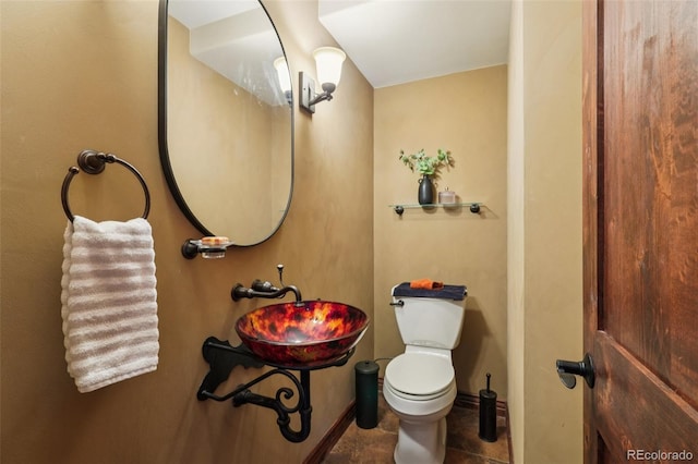 20033 Silver Ranch Rd, Conifer, CO 80433 - half bathroom featuring a sink and toilet