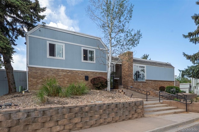 view of front of house featuring brick siding