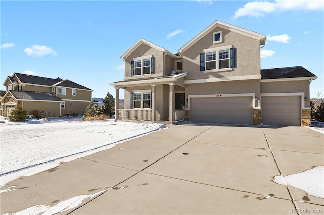 view of front of property with a porch and a garage