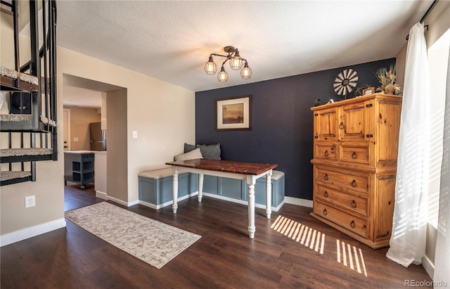 315 Maestes St, Johnstown, CO 80534 - dining room with an inviting chandelier, baseboards, and wood finished floors