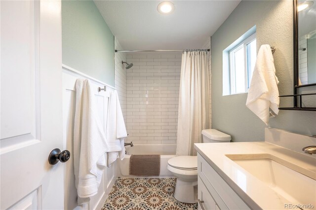 315 Maestes St, Johnstown, CO 80534 - full bath with vanity, tile patterned floors, shower / bath combo with shower curtain, and toilet