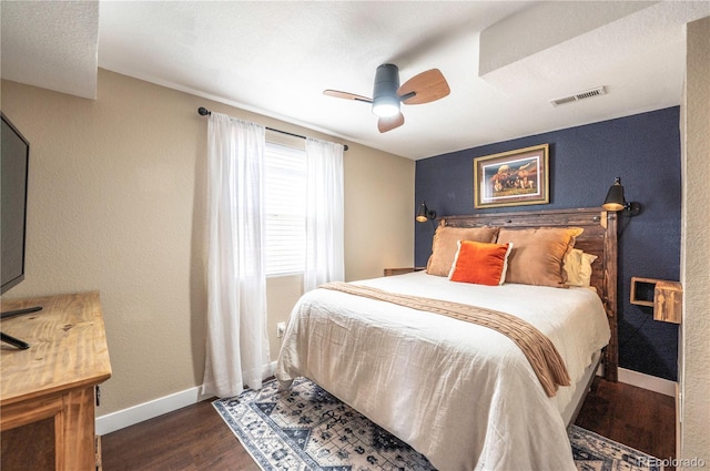 315 Maestes St, Johnstown, CO 80534 - bedroom with dark wood-type flooring, baseboards, ceiling fan, and visible vents