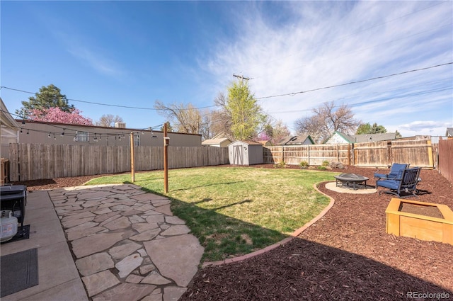 315 Maestes St, Johnstown, CO 80534 - view of yard featuring an outdoor structure, a patio, a fenced backyard, an outdoor fire pit, and a storage shed