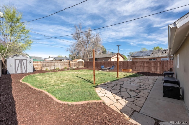 315 Maestes St, Johnstown, CO 80534 - view of yard featuring a storage shed, a patio, an outbuilding, and a fenced backyard