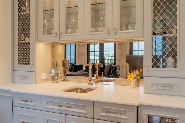 bar with french doors and sink