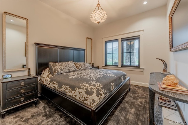 bedroom with hardwood / wood-style flooring