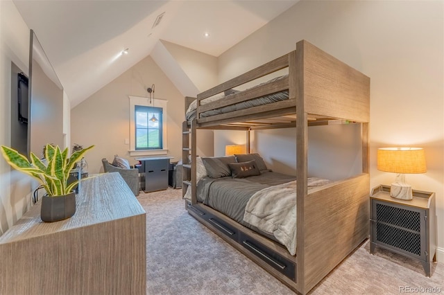 bedroom with light carpet and lofted ceiling