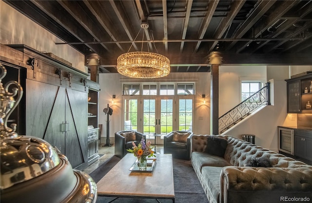 living room with a barn door and french doors