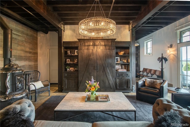 921 County Road 317, Crested Butte, CO 81224 - living area featuring a chandelier, wood walls, and beamed ceiling