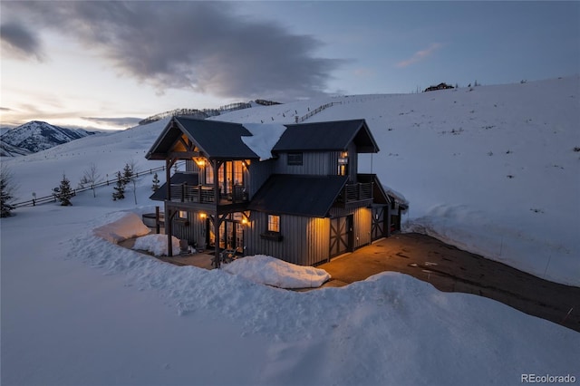 921 County Road 317, Crested Butte, CO 81224 - snow covered rear of property with a balcony