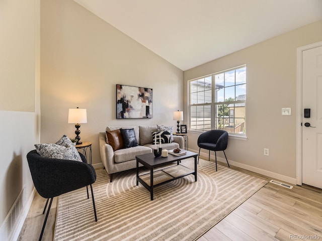 4287 Brookwood Pl, Highlands Ranch, CO 80130 - living room featuring light wood-style floors and vaulted ceiling