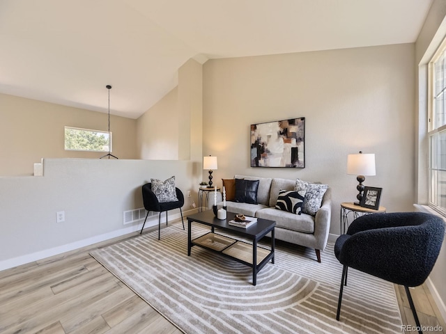 4287 Brookwood Pl, Highlands Ranch, CO 80130 - living area with wood finished floors, lofted ceiling, and plenty of natural light