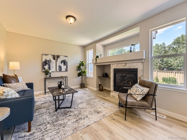 4287 Brookwood Pl, Highlands Ranch, CO 80130 - living room featuring wood finished floors and a tiled fireplace