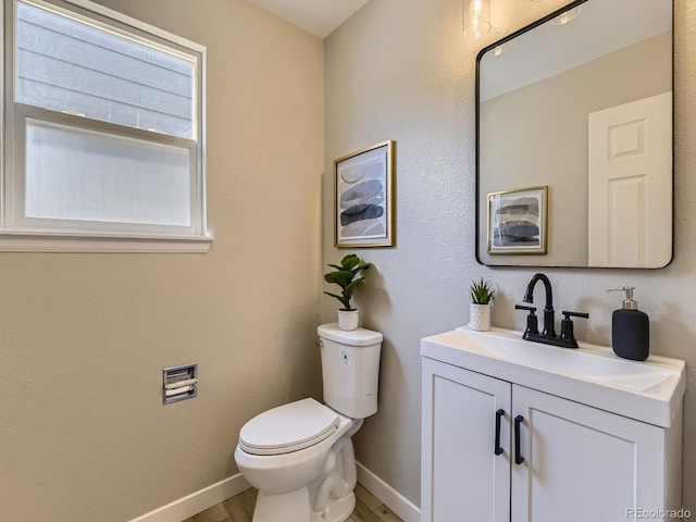 4287 Brookwood Pl, Highlands Ranch, CO 80130 - half bathroom with wood finished floors and vanity