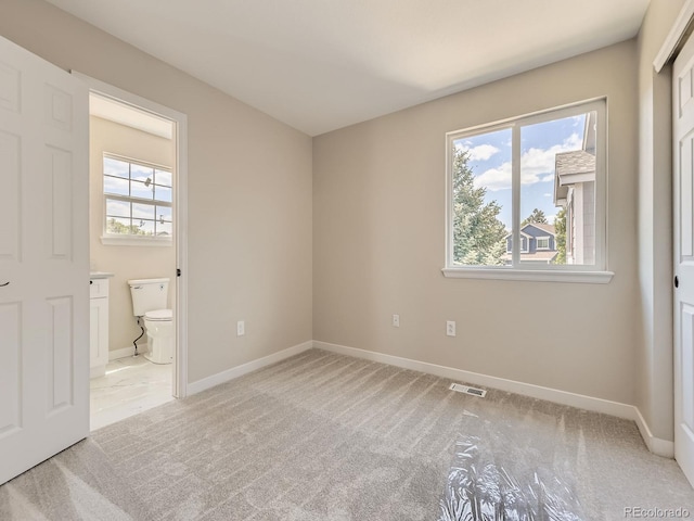 4287 Brookwood Pl, Highlands Ranch, CO 80130 - unfurnished bedroom with light colored carpet and ensuite bath