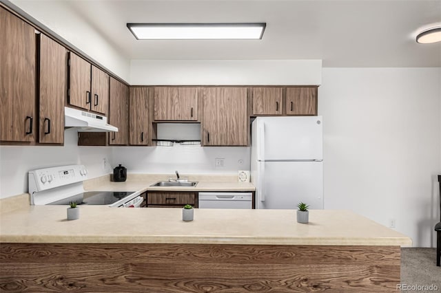 5995 W Hampden Ave Unit 20B, Denver, CO 80227 - kitchen featuring white appliances, under cabinet range hood, light countertops, and a peninsula