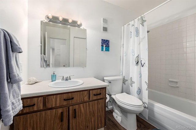 5995 W Hampden Ave Unit 20B, Denver, CO 80227 - bathroom with vanity, shower / tub combo with curtain, and wood finished floors