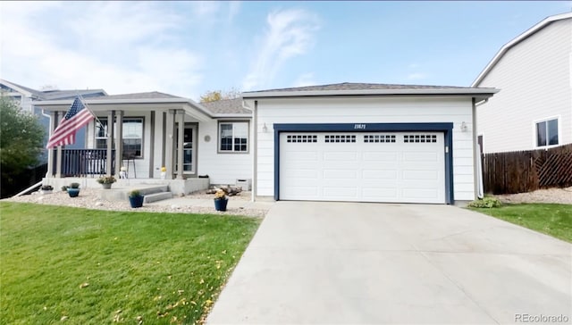 ranch-style home with a front lawn, fence, covered porch, a garage, and driveway