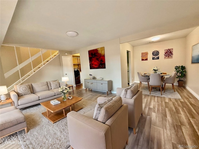 living room featuring hardwood / wood-style floors and washer / clothes dryer