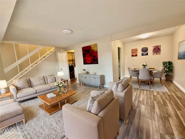 living room with hardwood / wood-style floors and washer / clothes dryer