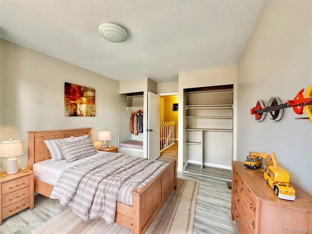 bedroom featuring light hardwood / wood-style flooring and a closet