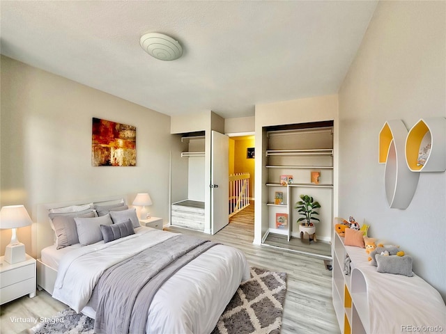 bedroom with light hardwood / wood-style floors