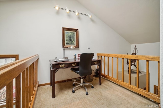 carpeted home office with lofted ceiling