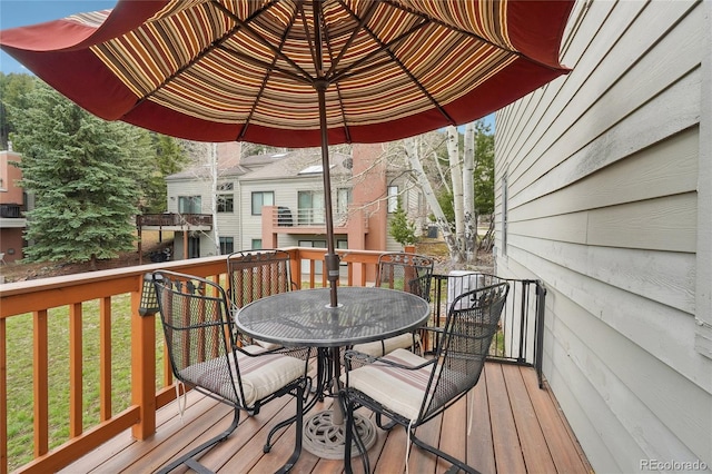 wooden deck with outdoor dining area