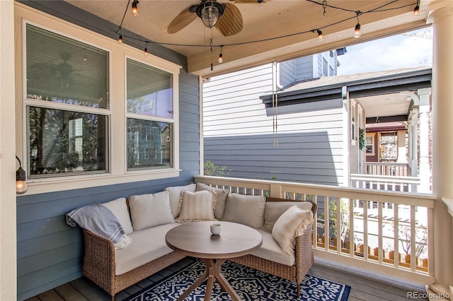 deck featuring a ceiling fan and an outdoor living space