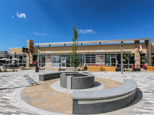 exterior space with central AC and stucco siding