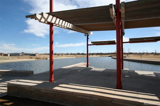 dock area with a water view