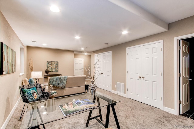 living room featuring baseboards, carpet, recessed lighting, and visible vents