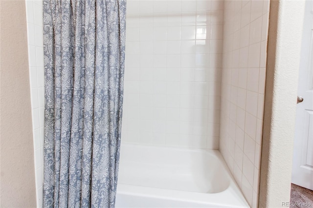 full bath featuring shower / bath combo with shower curtain