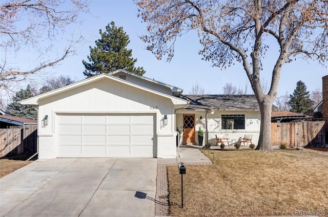 ranch-style home featuring concrete driveway, an attached garage, fence, and a front yard