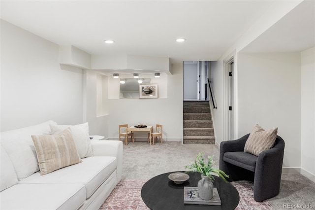 living area featuring carpet, stairs, baseboards, and recessed lighting