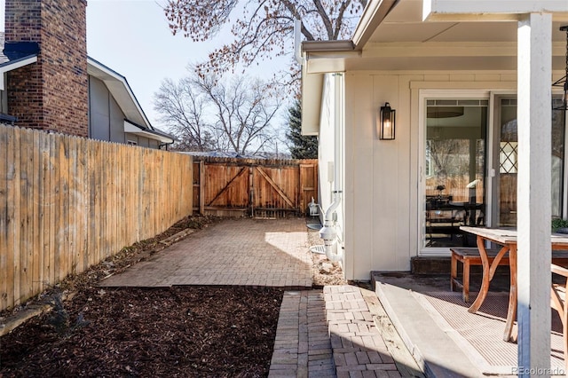 view of patio / terrace featuring a gate and fence