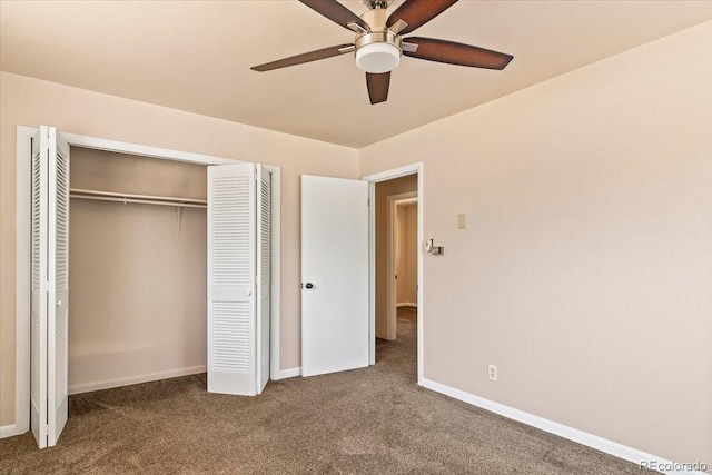 unfurnished bedroom with a closet, baseboards, and carpet