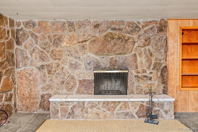 room details featuring carpet flooring and a fireplace