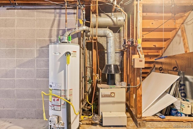 utility room featuring gas water heater